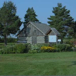 Image of log building in front of Municipal Office